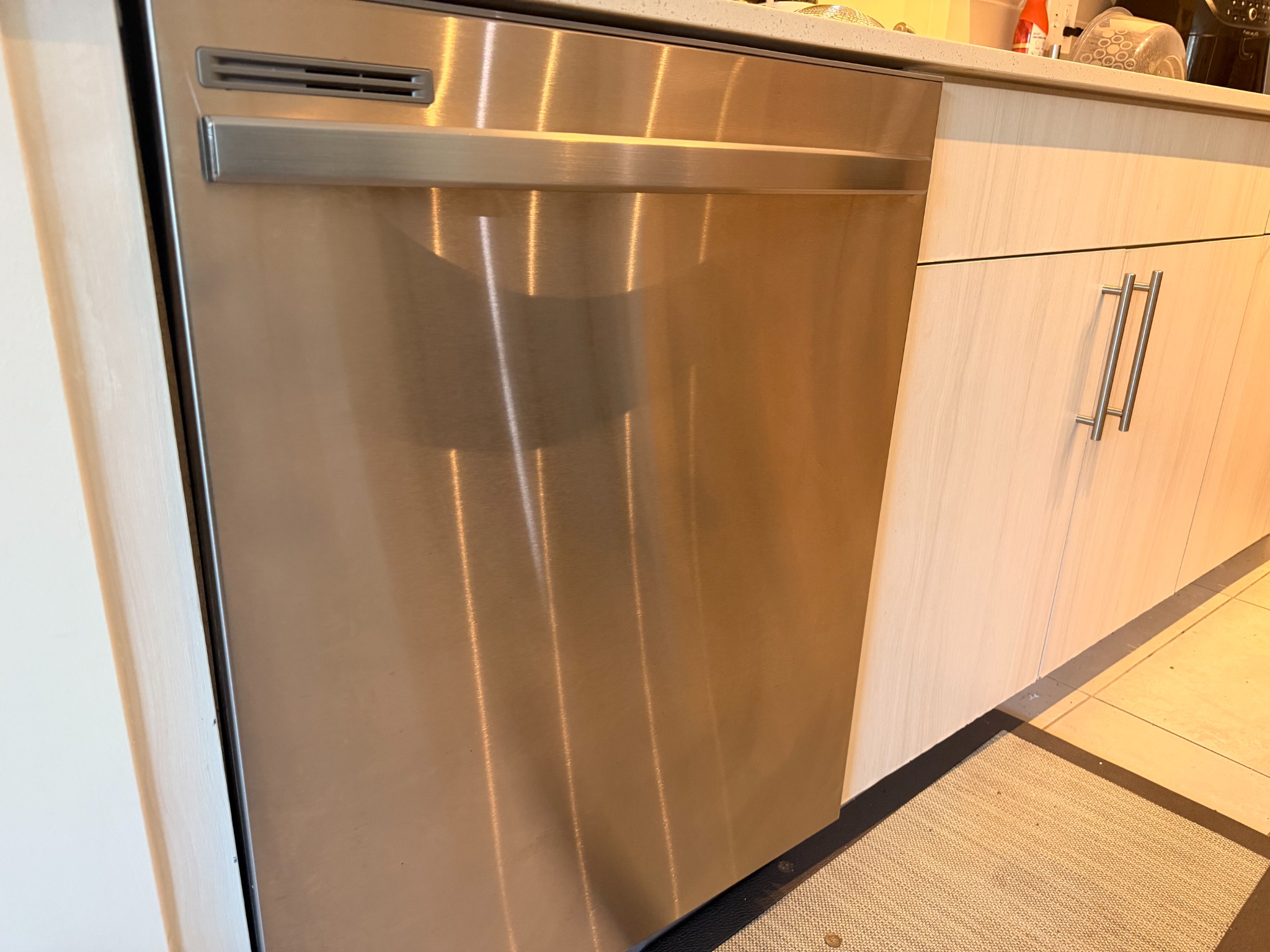Stainless-steel dishwasher exterior after cleaning.