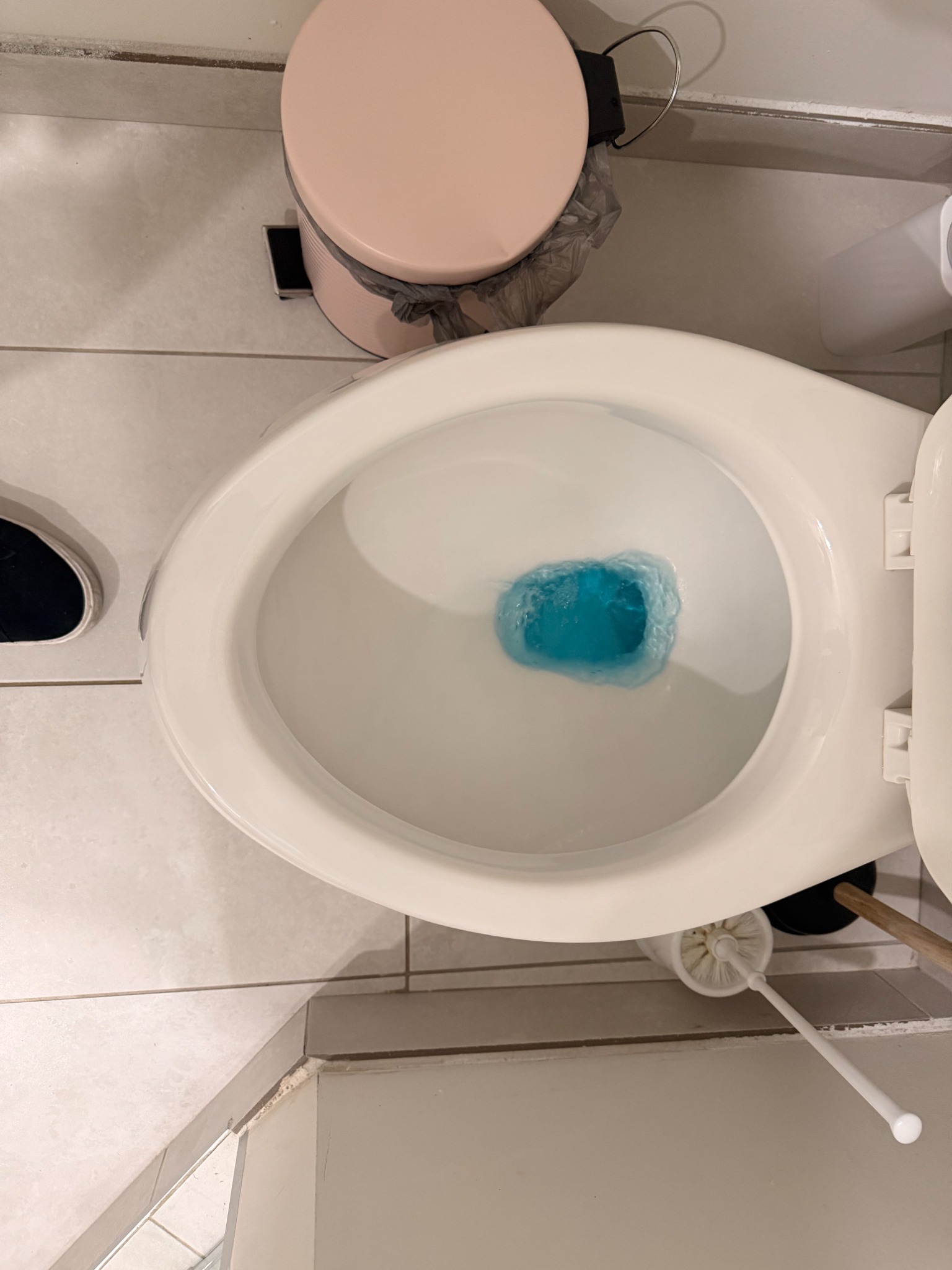 Toilet bowl after cleaning, with the visible ring removed.